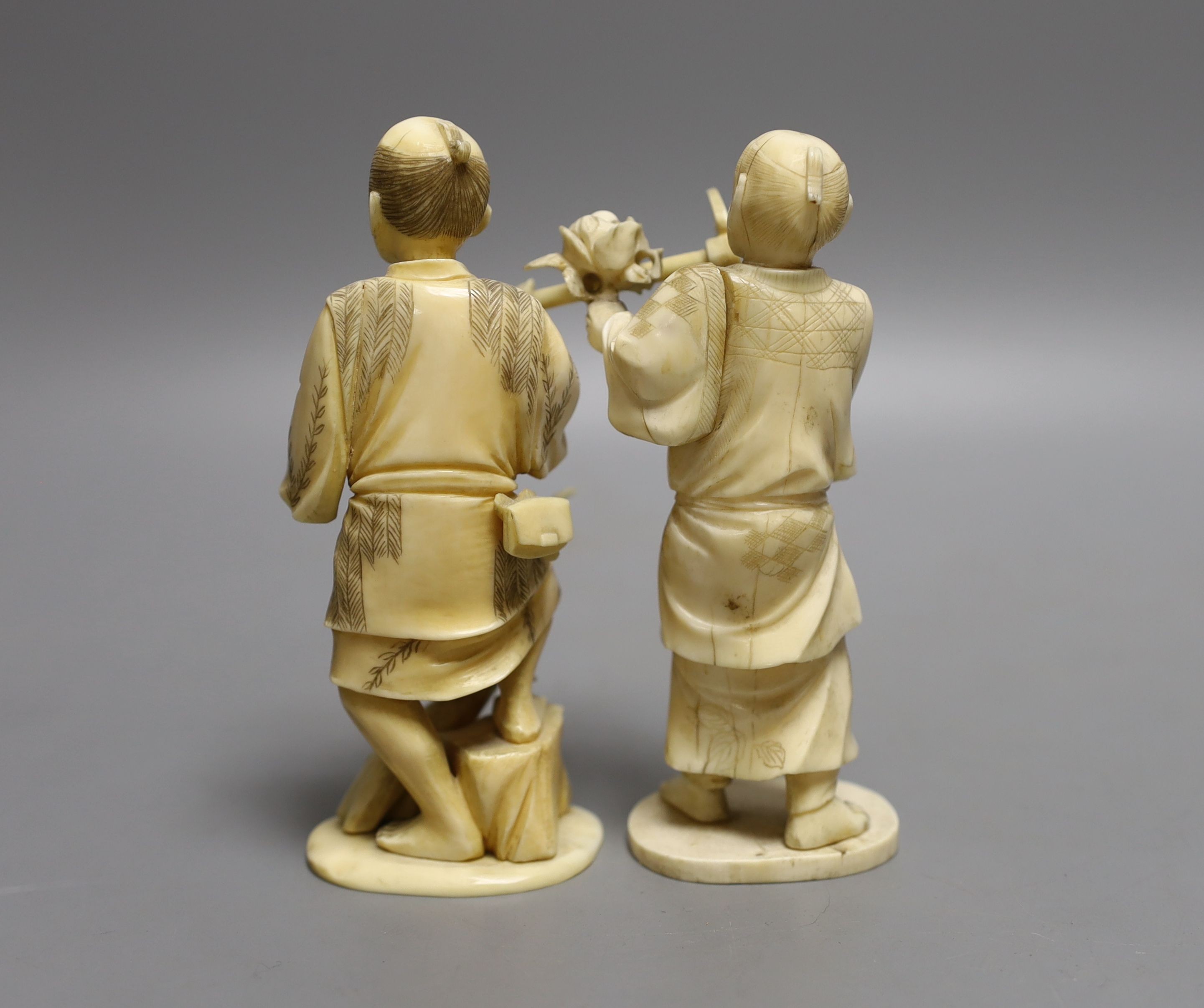 Two Japanese sectional ivory figures of farmers, early 20th century - tallest 13.5cm